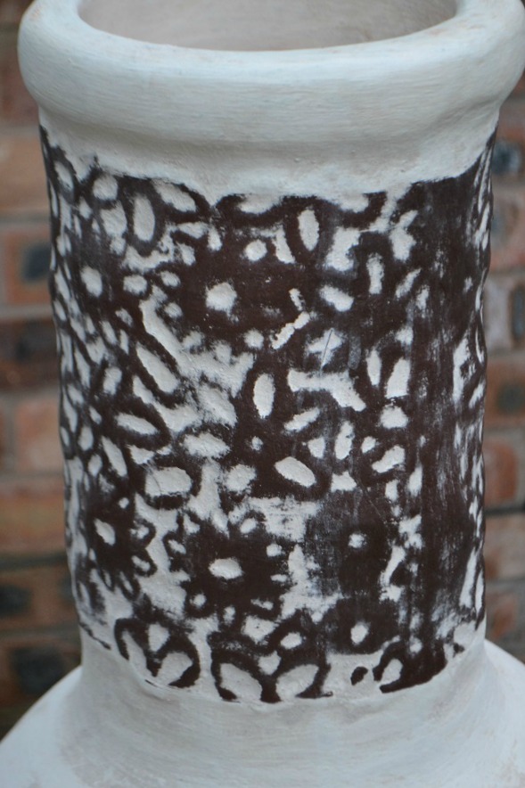 clay chiminea flower design